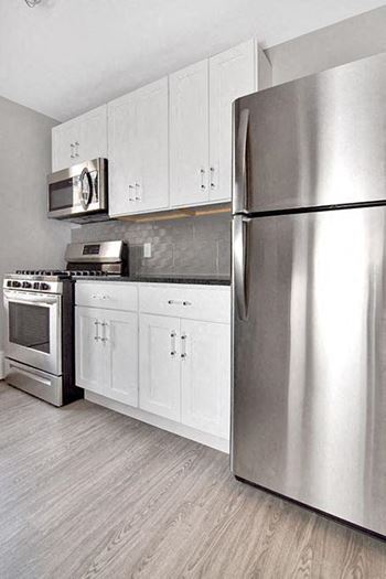 A modern kitchen with a stainless steel refrigerator